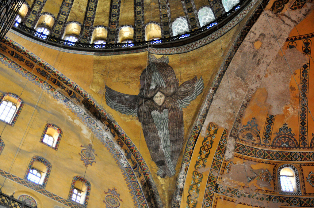 Seraphim angel mosaic in Hagia Sophia with its face uncovered during the 2009 restoration period, offering a rare glimpse into the original Byzantine iconography beneath the dome. Photo by Serhat Engul.